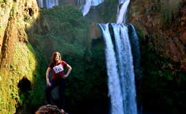 Kiersten Westbrook ’09 dons her Griz gear at the Cascades d’Ouzoud in the Atlas Mountains of Morocco.